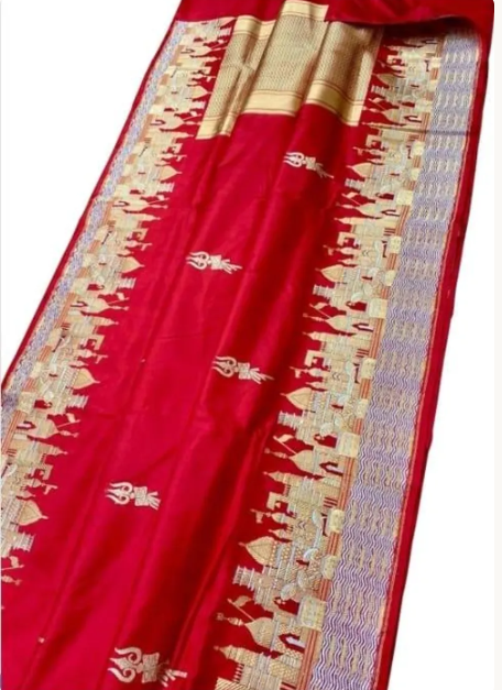 Exquisite Rustic Red Banarasi Katan Silk Saree featuring the legendary Kashi Ghat Meenakari design. Silk Mark Certified for 100% purity. A masterpiece of handloom storytelling.