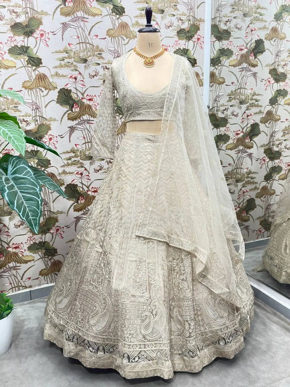 Beige Net Lehenga With Shining Thread Embroidery