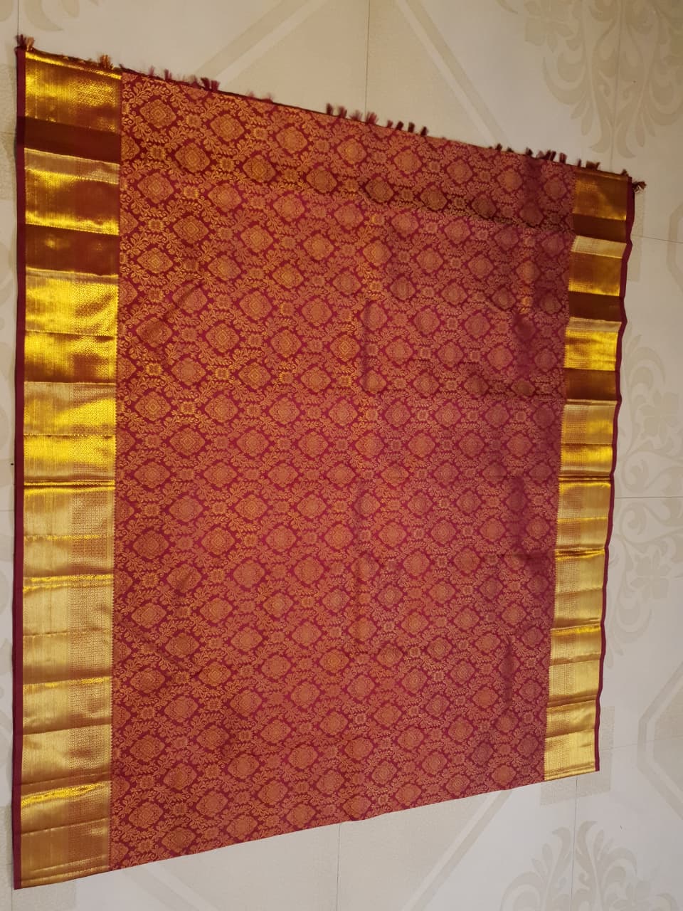Red Kanchipuram handloom 2G gold pattu silk saree featuring intricate gold brocade weaving and a detailed Lord Murugan pallu.