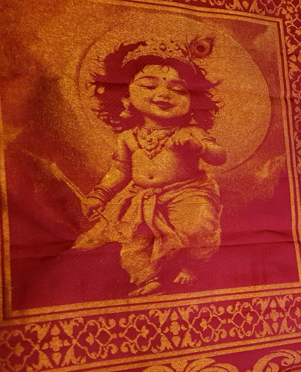 Red Kanchipuram handloom 2G gold pattu silk saree featuring intricate gold brocade weaving and a detailed Lord Murugan pallu.