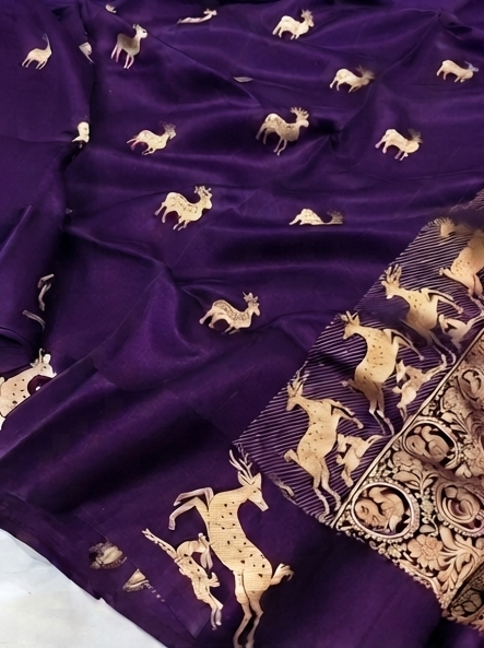 Luxurious purple Mashru silk fabric with detailed gold zari Kaduwa floral and animal motifs, highlighting the authentic handloom craftsmanship.