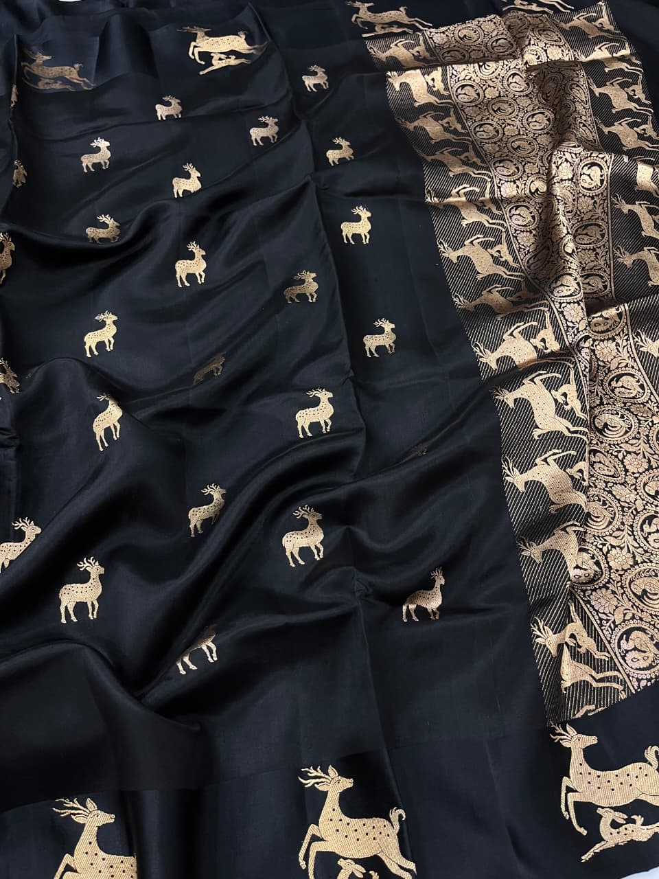 Black Banarasi Handloom Mashru Silk Saree featuring authentic Kaduwa weaving, intricate gold zari deer and animal motifs, a rich traditional Banarasi pallu, Silk Mark Certified pure silk, dyeable to your choice of colors, and includes a running blouse piece—perfect for weddings, festive occasions, and luxury ethnic wear.