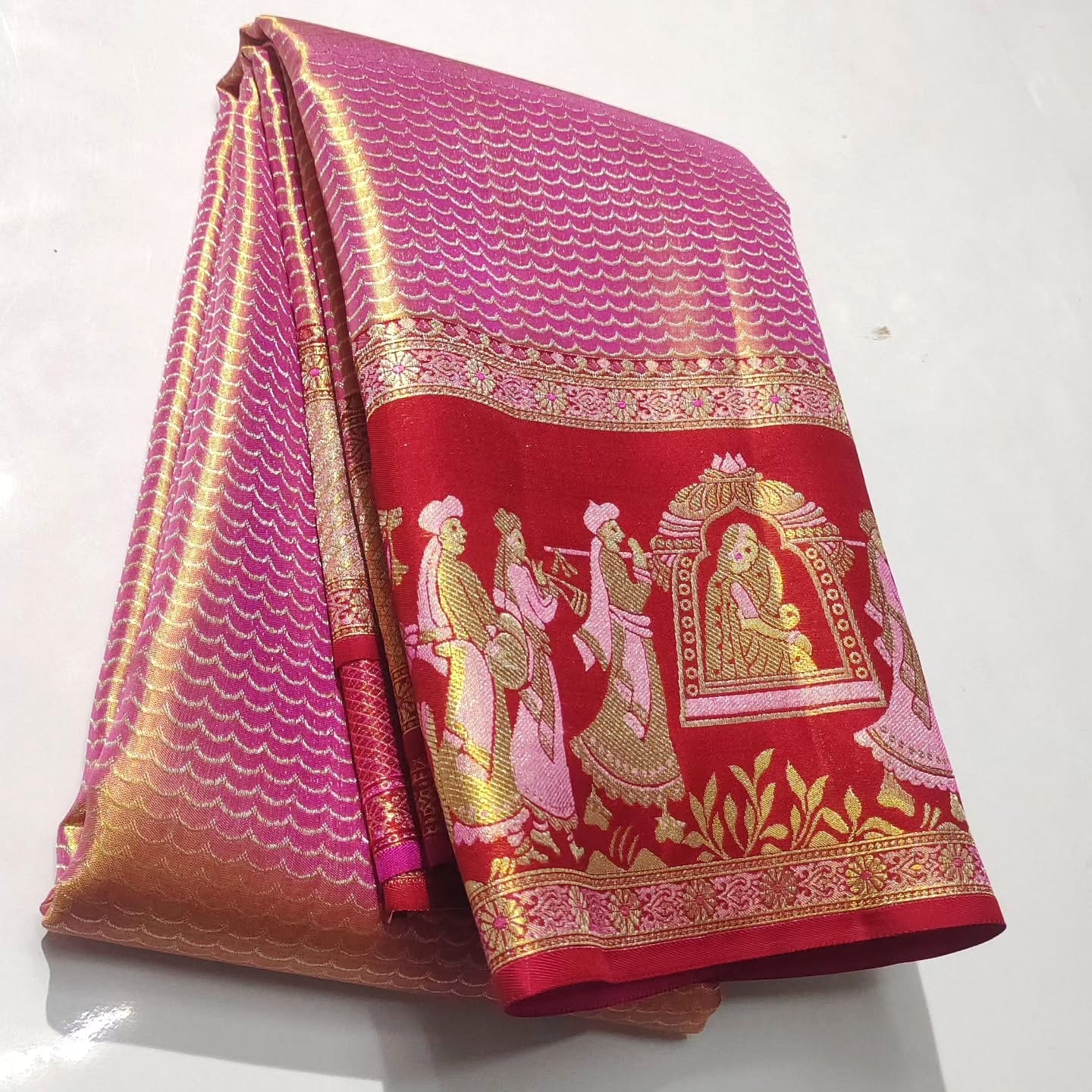Rani Pink Kanchipuram handloom double warp tissue brocade silk saree with intricate Kalyana Pallakku motifs and a grand rich border.
