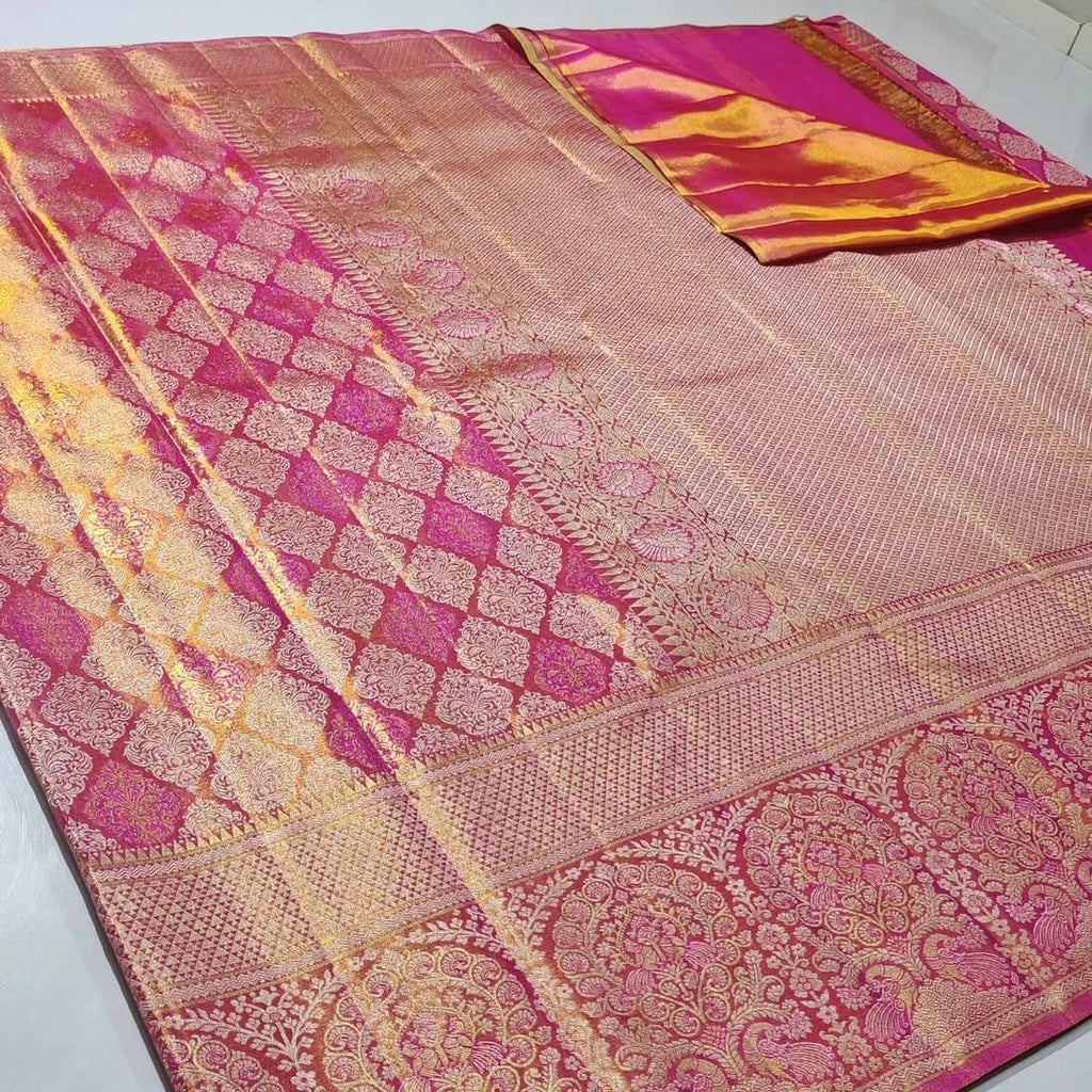 Hot Pink Kanchipuram Tissue Silk saree featuring intricate Meena work and golden floral brocade.