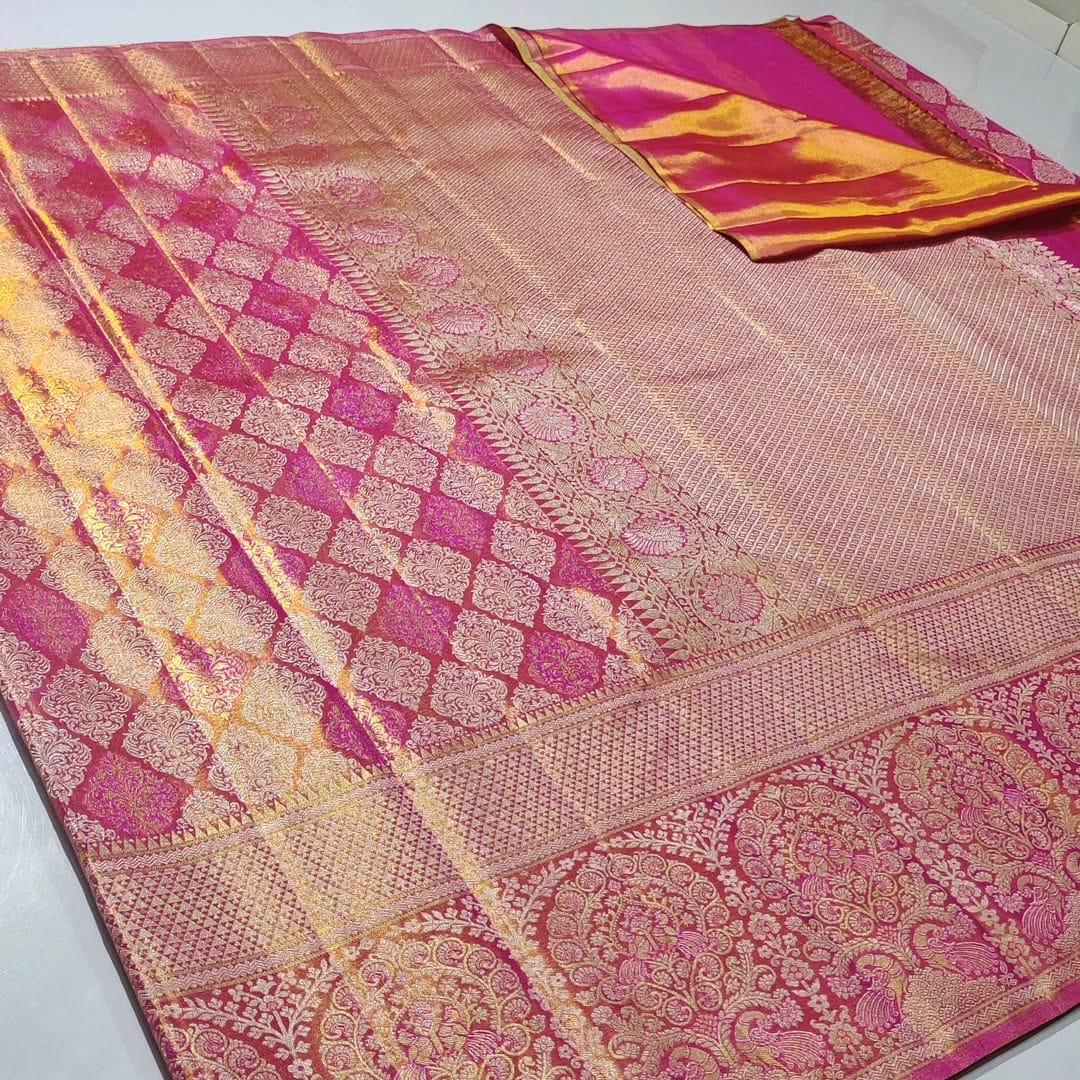 Hot Pink Kanchipuram Tissue Silk saree featuring intricate Meena work and golden floral brocade.