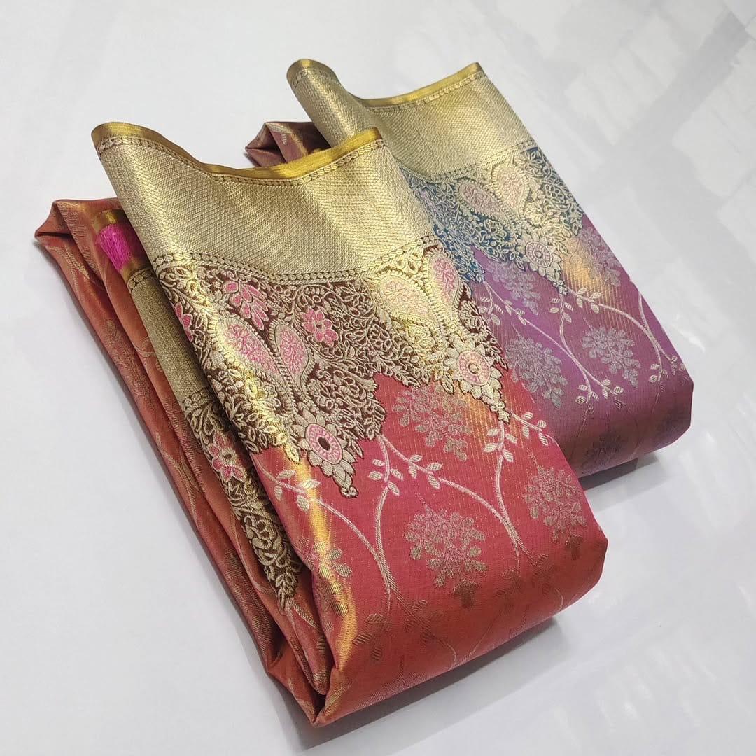 A luxurious Peach Pink Kanchipuram Handloom Tissue Silk Saree with all-over gold floral brocade and intricate colorful Meenakari detailing on the body and pallu.