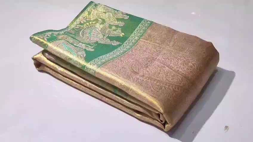 Baby Pink Kanchipuram handloom silk saree featuring intricate gold tissue brocade and a traditional Kalyana Pallakku motif border.