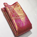 Rani Pink Kanchipuram handloom tissue brocade silk saree with intricate Meenakari floral patterns and a rich golden zari border.