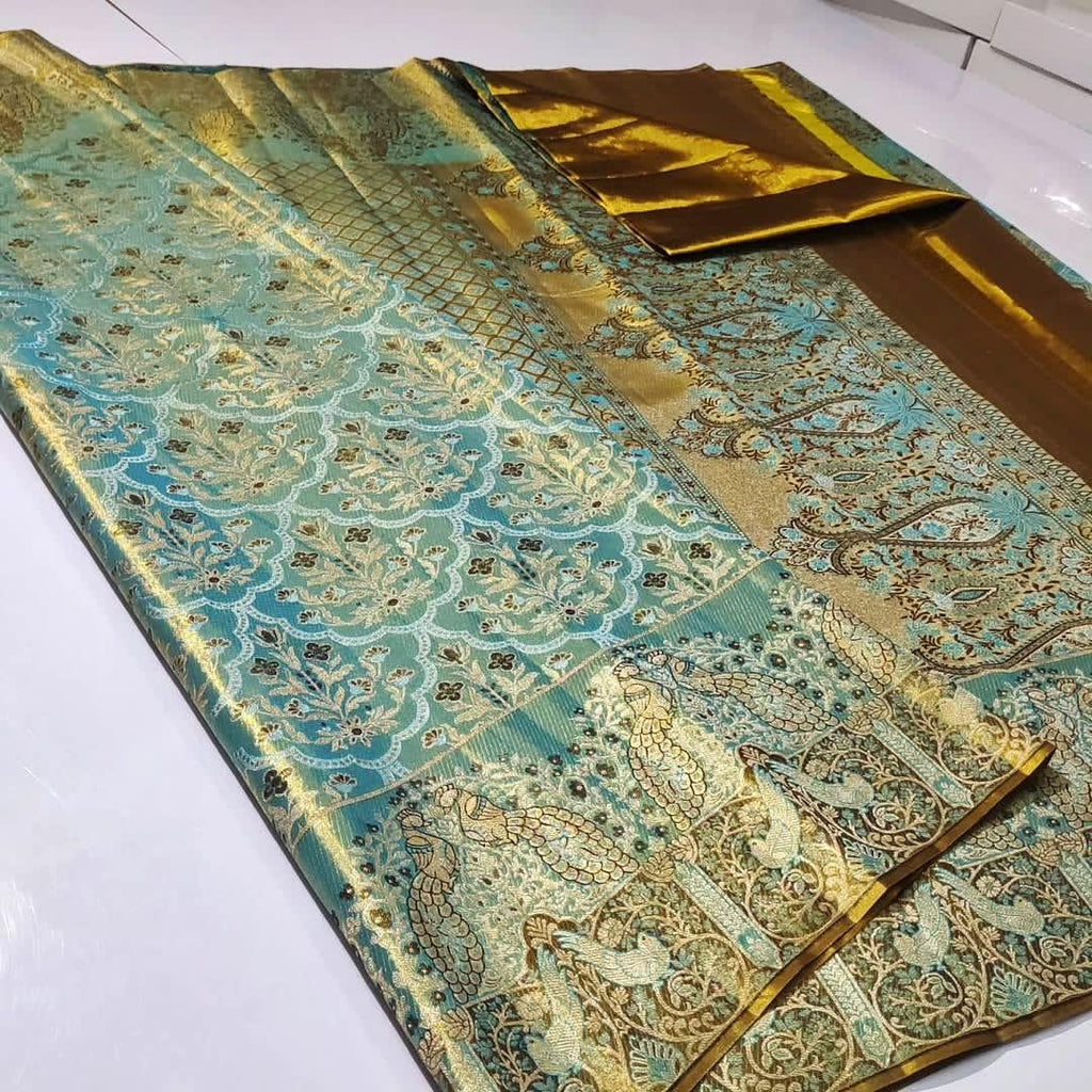 Radiant turquoise Kanchipuram handloom tissue brocade silk saree adorned with intricate multicolored Meenakari weaving and pure zari work.