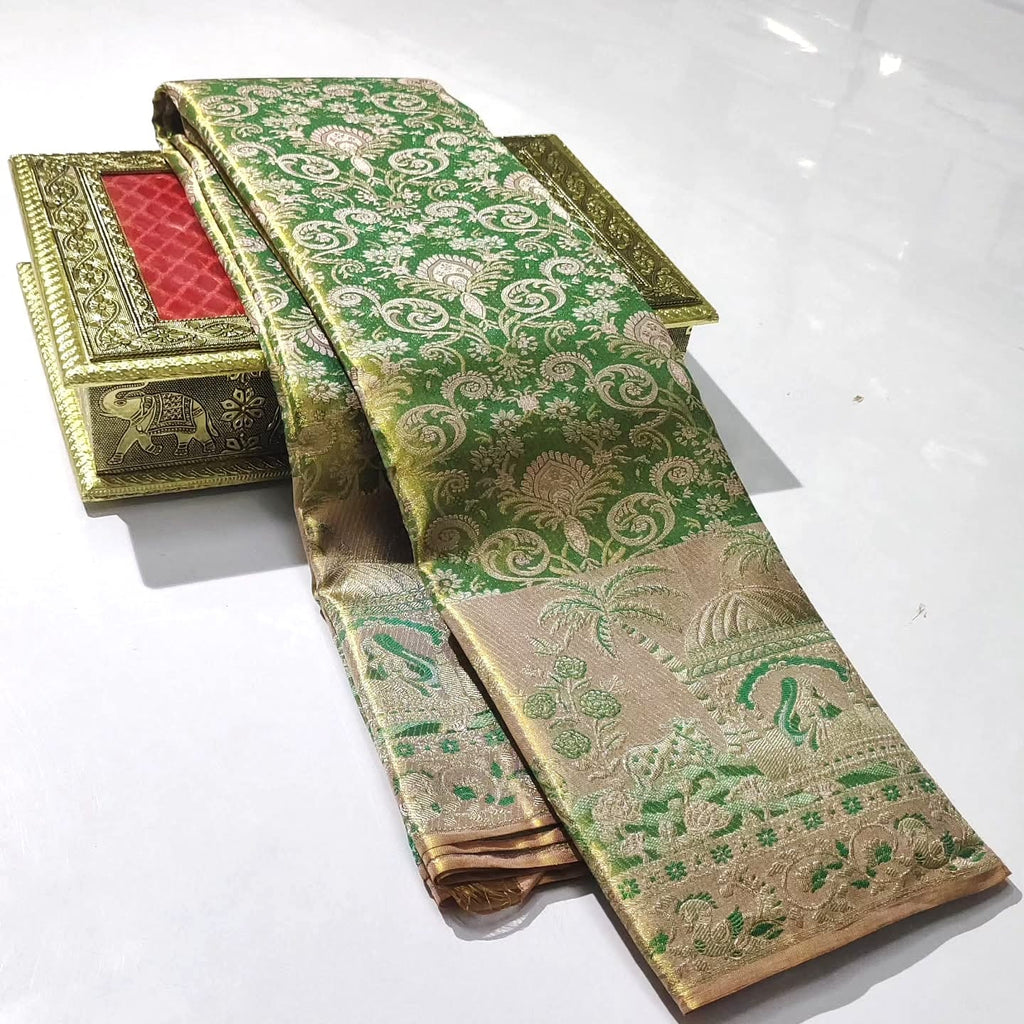 Green Kanchipuram handloom tissue brocade silk saree with edge-to-edge Meenakari floral patterns and golden zari weaving.