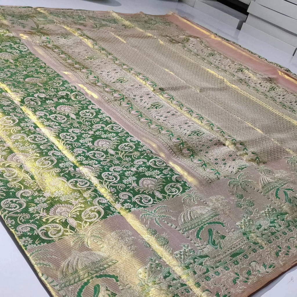 Green Kanchipuram handloom tissue brocade silk saree with edge-to-edge Meenakari floral patterns and golden zari weaving.