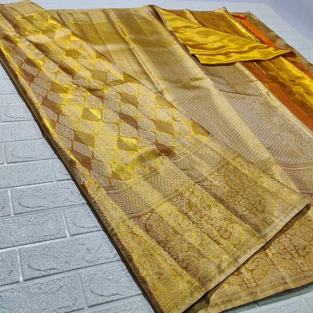 Gold Kanchipuram Tissue Silk saree featuring intricate edge-to-edge checks and floral butta embroidery.