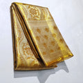 Stunning Gold Kanchipuram handloom tissue brocade silk bridal saree with rich zari work and intricate traditional borders.