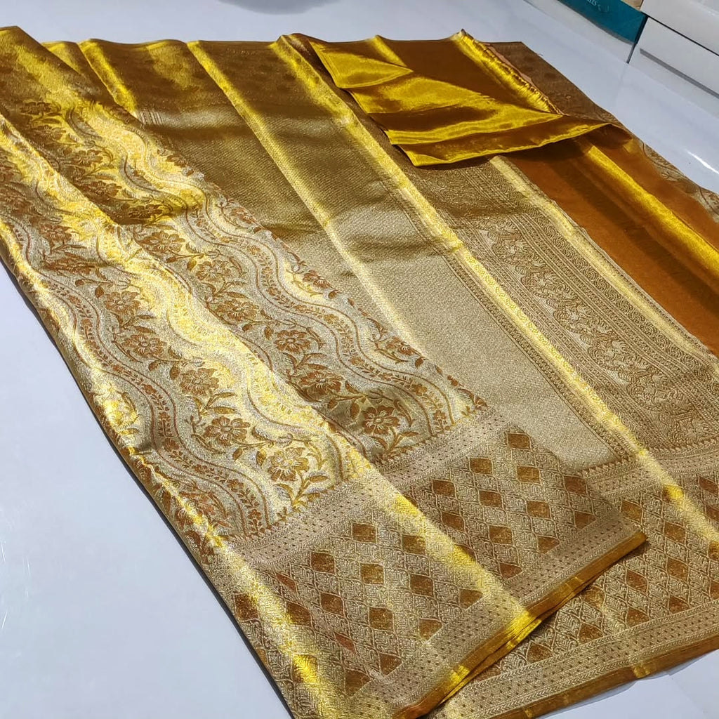 Stunning Gold Kanchipuram handloom tissue brocade silk bridal saree with rich zari work and intricate traditional borders.