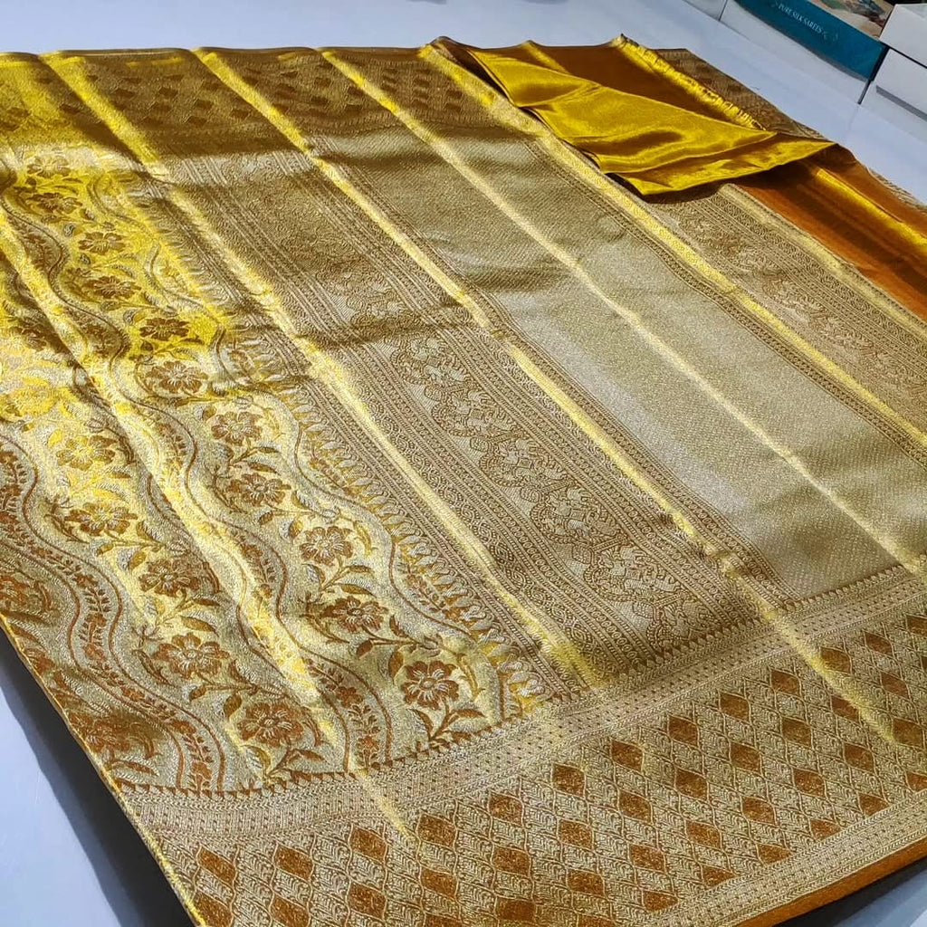 Stunning Gold Kanchipuram handloom tissue brocade silk bridal saree with rich zari work and intricate traditional borders.