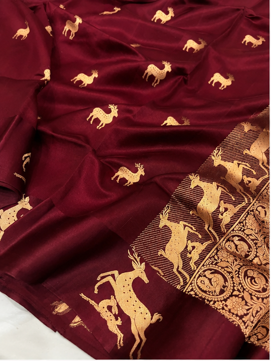 Plum Banarasi Handloom Mashru Silk Saree featuring authentic Kaduwa weaving, intricate gold zari deer and animal motifs, a rich traditional Banarasi pallu, Silk Mark Certified pure silk, dyeable to your choice of colors, and a matching running blouse piece, perfect for weddings and festive occasions.