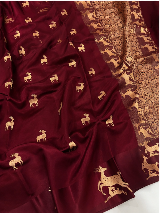 Plum Banarasi Handloom Mashru Silk Saree featuring authentic Kaduwa weaving, intricate gold zari deer and animal motifs, a rich traditional Banarasi pallu, Silk Mark Certified pure silk, dyeable to your choice of colors, and a matching running blouse piece, perfect for weddings and festive occasions.